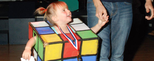 Child dressed as rubics cube